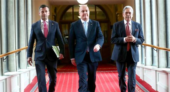 (L-R): ACT leader David Seymour, NZ Prime Minister-elect Christopher Luxon, and NZ First leader Winston Peters (Image: AAP/Mark Mitchell/NZ Herald/AP)