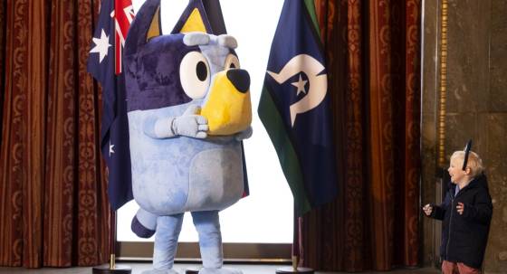 Bandit from hit show Bluey with a fan (Image: PA/David Parry)